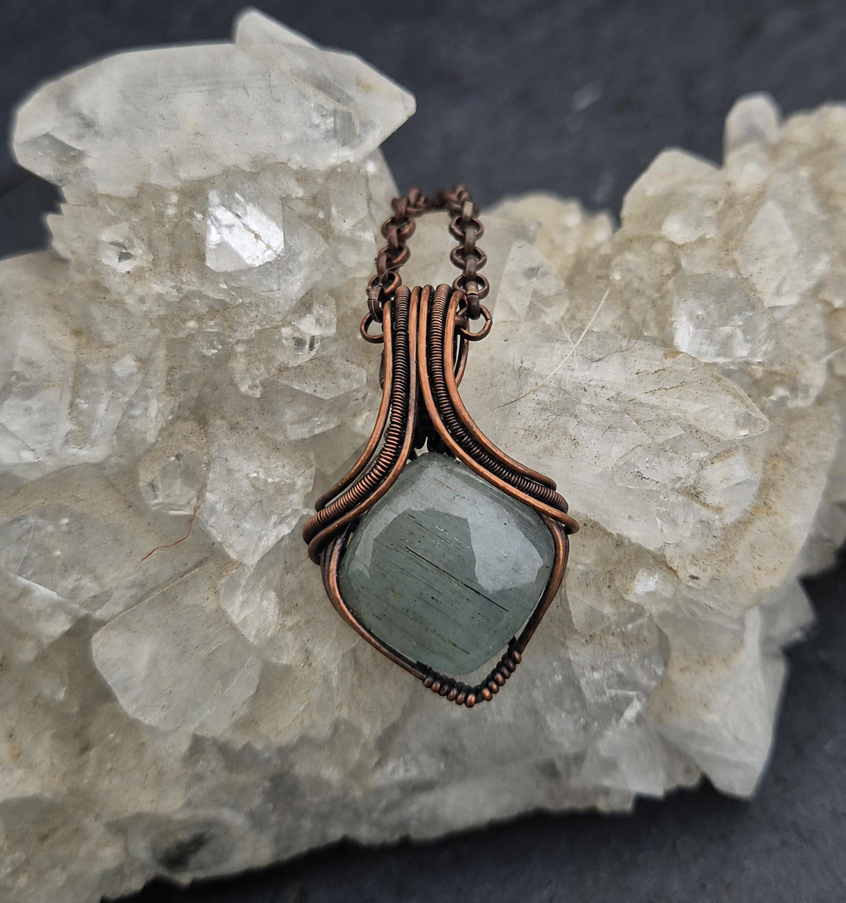 Aquamarine Pendant photographed with mineral crystals